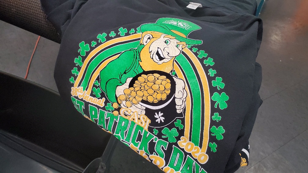Custom St. Patrick's Day t-shirt with leprechaun and shamrocks for festive wear.