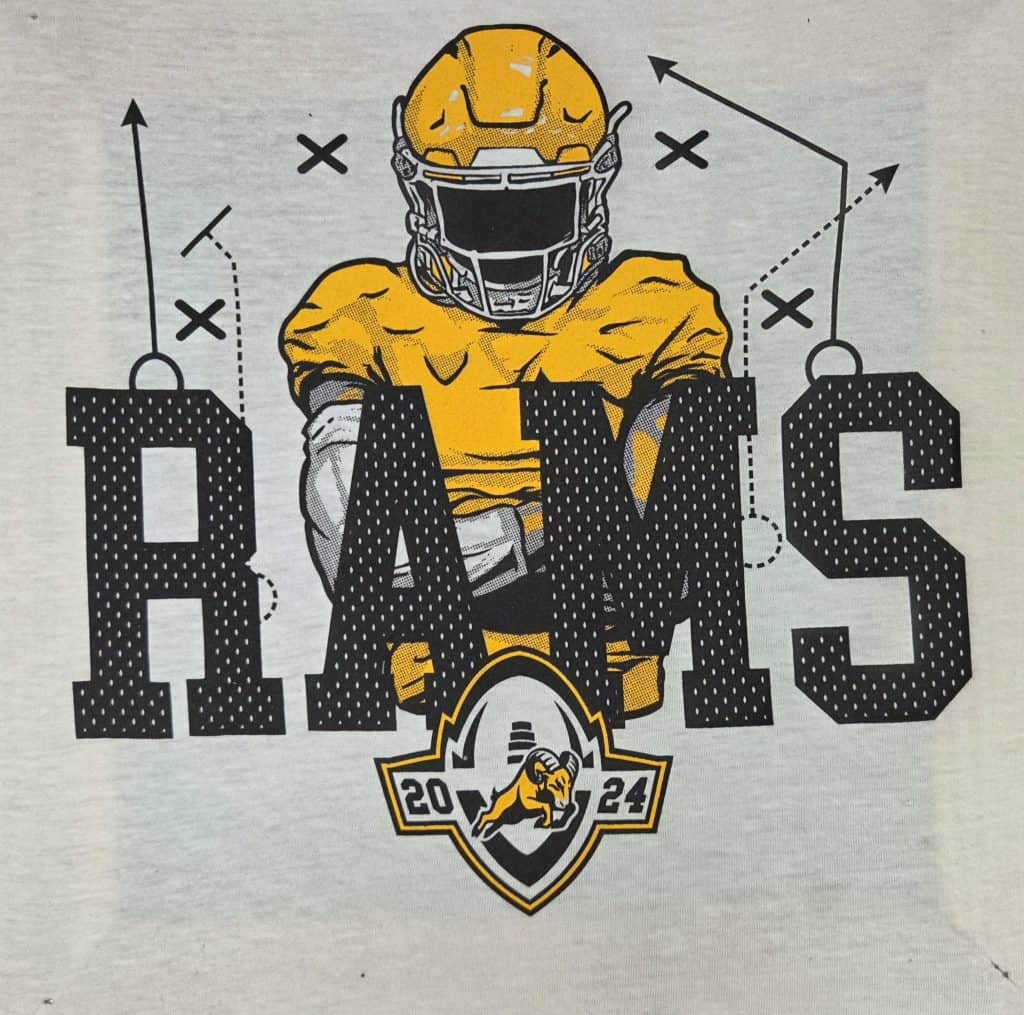 Rams football helmet with team name and year 2024 on a T-shirt.